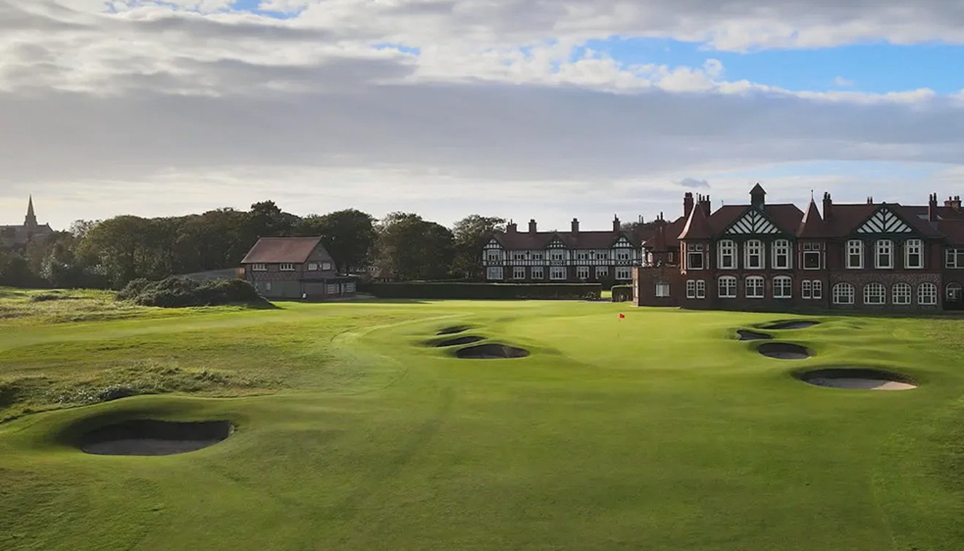 The 18th hole of Royal Lytham & St Annes Golf Club lies under cloudy sky in front of the clubhouse in Lytham & St Annes, England.