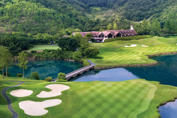 The 18th hole at Golden Valley Golf Club runs over a winding lake and up to the clubhouse just outside of Osaka, Japan.