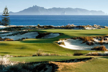 An winding hole at Te Arai Links course in Tomarata, New Zealand carving through the beach along the South Pacific coast.