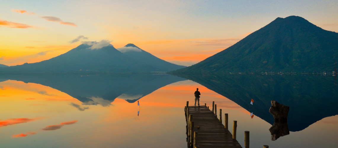Enchanting Travels Guatemala Tours Observing the incredible beautiful sunrise at Lake Atitlan in Guatemala.