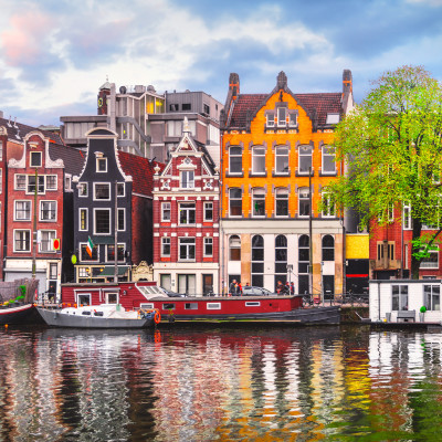 Amsterdam Netherlands dancing houses over river Amstel landmark in old european city spring landscape.