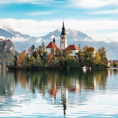 Church of Assumption in Lake Bled, Slovenia with blue sky and clouds in the autumn - Slovenia & Croatia Tours
