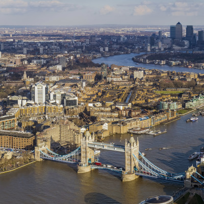 London aerial skyline view, Tower Bridge with Double Decker Bus, the City Hall, skyscrapers of Canary Wharf