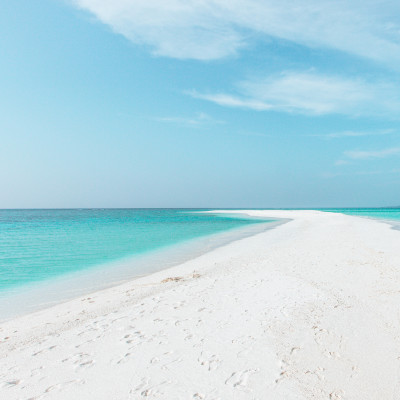 Sandbank in Maldives with crystal clear beautiful water and white sand