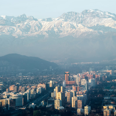 Urban sprawl in the city of Santiago in Chile with the Andes Mountains, South America