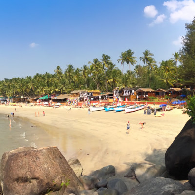 goa beach with people on the shore in India