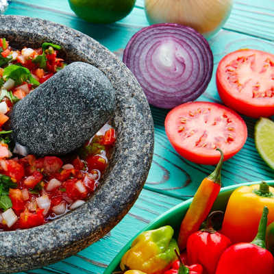 Mexican cuisine Pico de Gallo sauce from Mexico with tomato cilantro and onion in molcajete