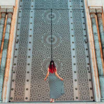 Morocco travel guide - Girls standing in front of greatest mosque Hasan II in Morocco, Africa - Top six destinations we can't wait to visit again