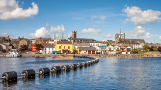 Colourful houses and historic churches line the riverside in the lively town of Athlone.