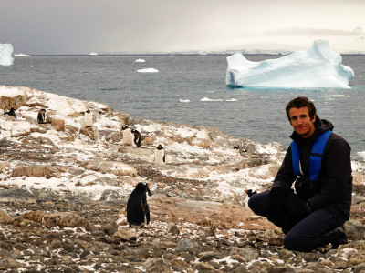 Enchanting Travels Antarctica Tours Tourist meets penguins in Antarctica