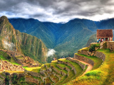 Enchanting Travels Peru Tours - Panoramic HDR image of Machu Picchu, the lost city of the Incas on a cloudy day. Machu Picchu is one of the new 7 Wonder of the Word near Cusco