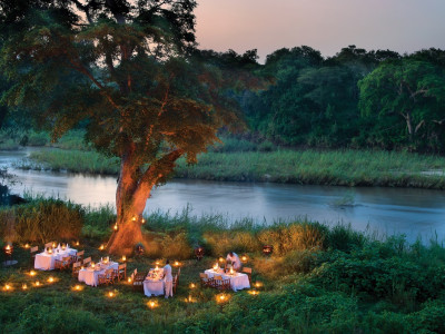 Outdoor dinner at Lion Sands Narina Lodge Hotel, South Kruger in South Africa