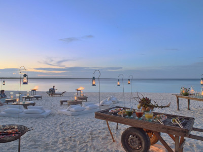 Romantic dinner at the beach at hotel Mnemba Island Lodge, Zanzibar, Tanzania - Perfect for Winter travel