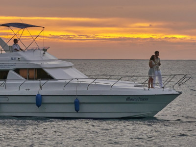 Couples enjoying in cruise during sunset