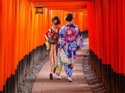 Top 10 temples in Japan - Women in traditional japanese kimonos walking at Fushimi Inari Shrine in Kyoto, Japan
