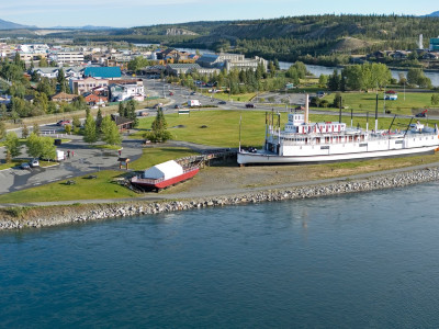 a large body of water with a city in the background