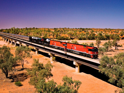 a train crossing a bridge over a river