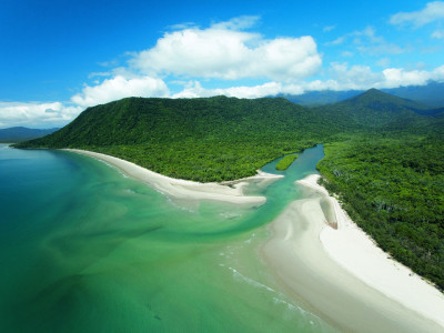 a body of water with Cape Tribulation, Queensland in the background