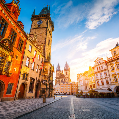 View of the town Hall and Temple of Our Lady before Tyn in sunlight at dawn Prague Czech Republic