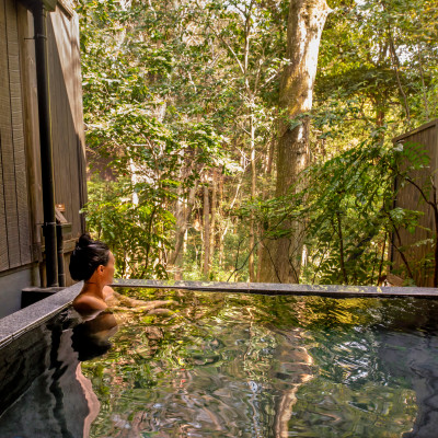Peaceful Asian Woman in Onsen luxury spa vacation