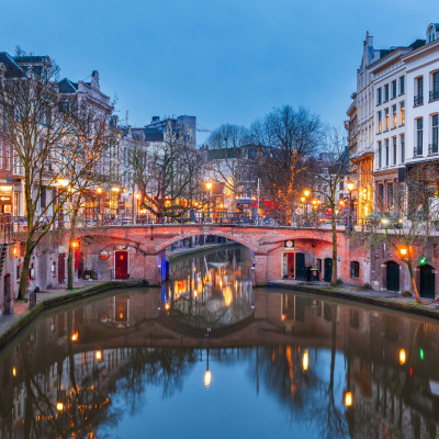 Utrecht, Netherlands canals and cityscape at twilight.