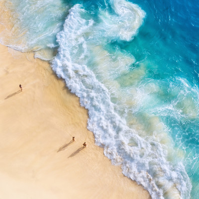 Beach, people and waves. Coast as a background from top view. Blue water background from drone. Summer seascape from air. Nusa Penida island, Indonesia. Travel - image