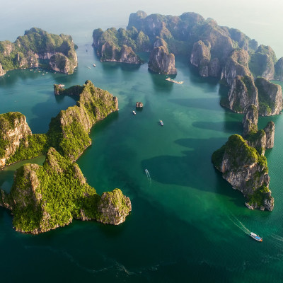 Aerial view of floating fishing village and rock island UNESCO World Heritage Site. Halong Bay, Vietnam
