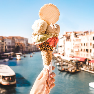 Delicious icecream in beautiful Venezia, Italy in front of a canal and historic buildings