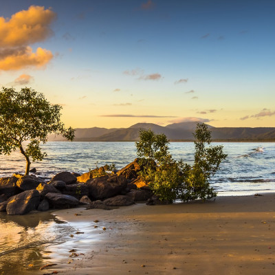 Enchanting Travels - Acolourful sunrise 4 mile beach tropical Port Douglas Coral sea clear calm ocean morning north queensland