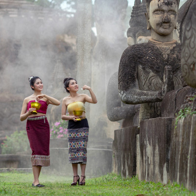 Beautiful Lao woman splashing water during Songkran Festival, Lao Vientiane Tradition, Asia - Laos travel guide