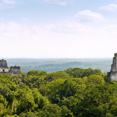 Mayan ruins rise above the jungle in the famous Tikal National Park, Guatemala