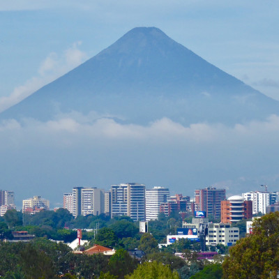 A low cloud base covers part of Fuego volcano in Guatemala City, capital of Guatemala