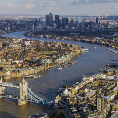 London aerial skyline view, Tower Bridge with Double Decker Bus, the City Hall, skyscrapers of Canary Wharf