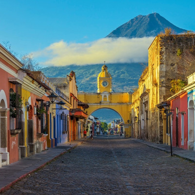 Enchanting Travels Guatemala Tours Antigua Cityscape in the main street of Antigua city with the Agua volcano in the background