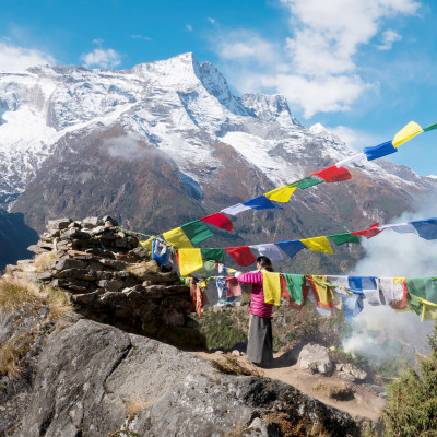 Nepali women replacing prayer flags, Namche Bazaar village, Sagarmatha Park, Himalayas, Nepal