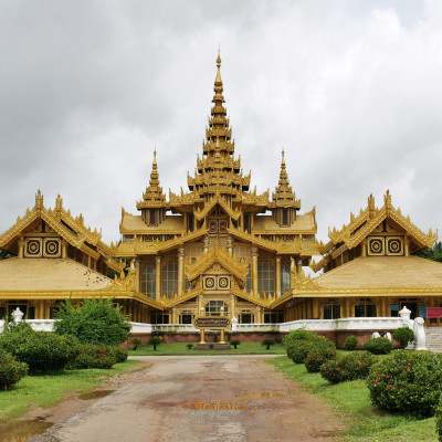 The green garden and the pathway beside the public temple after the rain stopped