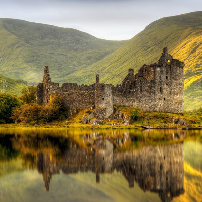 Enchanting Travels UK & Ireland Tours Kilchurn Castle reflections in Loch Awe at sunset, Scotland