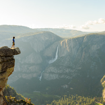 Hiker at the Glacier Point with View to Yosemite Falls and Valley