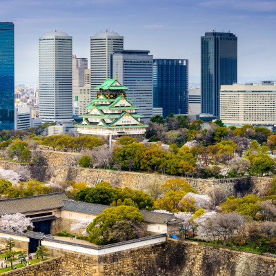 Osaka, Japan city skyline at the castle and business park in the spring.