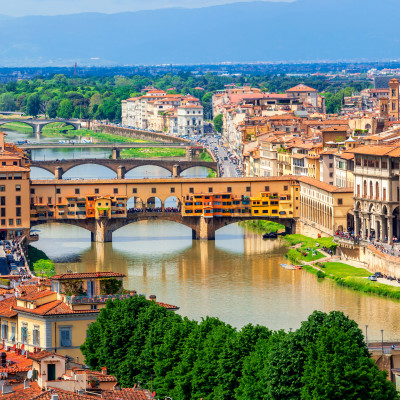 View of medieval stone bridge Ponte Vecchio over Arno river in Florence, Tuscany, Italy. Florence cityscape. Florence architecture and landmark.