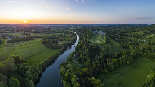 Aerial of Le Boat Horizon 4 houseboat on Thames River with Cliveden National Trust at sunset, near Maidenhead, Berkshire, England, United Kingdom