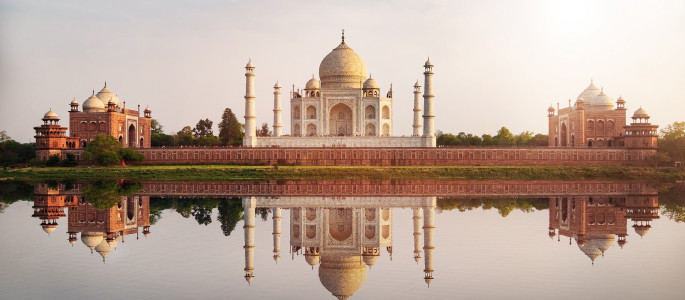 Sun set at Taj Mahal seen from Mehtab Bagh reflect on Yamuna river, an ivory-white marble mausoleum on the south bank of the Yamuna river in Agra, Uttar Pradesh, Enchanting Travels India tours