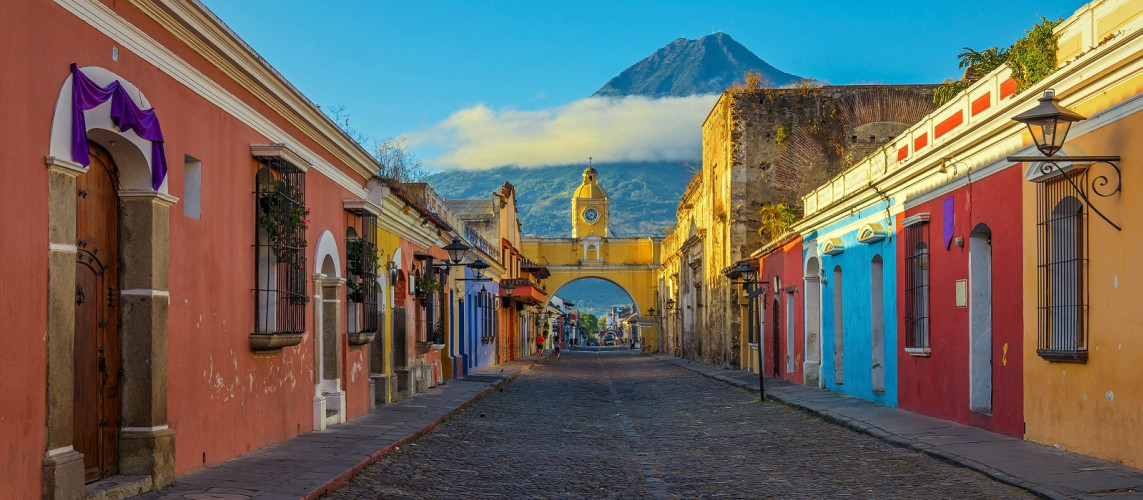 Enchanting Travels Guatemala Tours Antigua Cityscape in the main street of Antigua city with the Agua volcano in the background