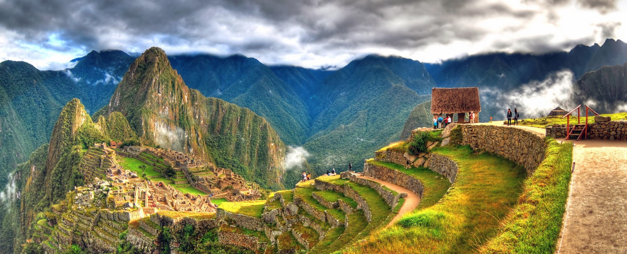 Enchanting Travels Peru Tours - Panoramic HDR image of Machu Picchu, the lost city of the Incas on a cloudy day. Machu Picchu is one of the new 7 Wonder of the Word near Cusco