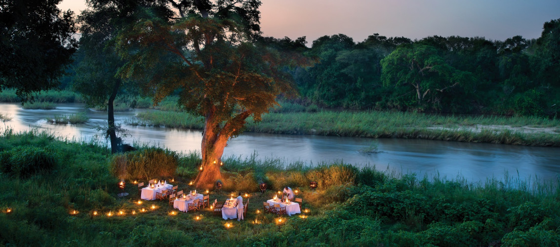 Outdoor dinner at Lion Sands Narina Lodge Hotel, South Kruger in South Africa