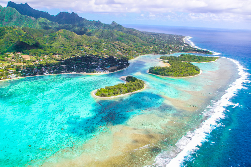 Beautiful beaches white sand clear turquoise water blue lagoons green mountains Cook islands Pacific islands