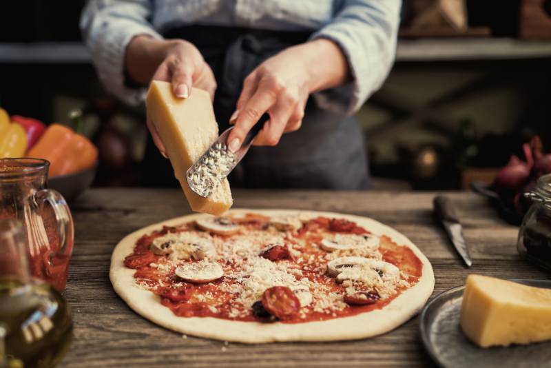 Fresh original Italian raw pizza preparation in traditional style Making pizza