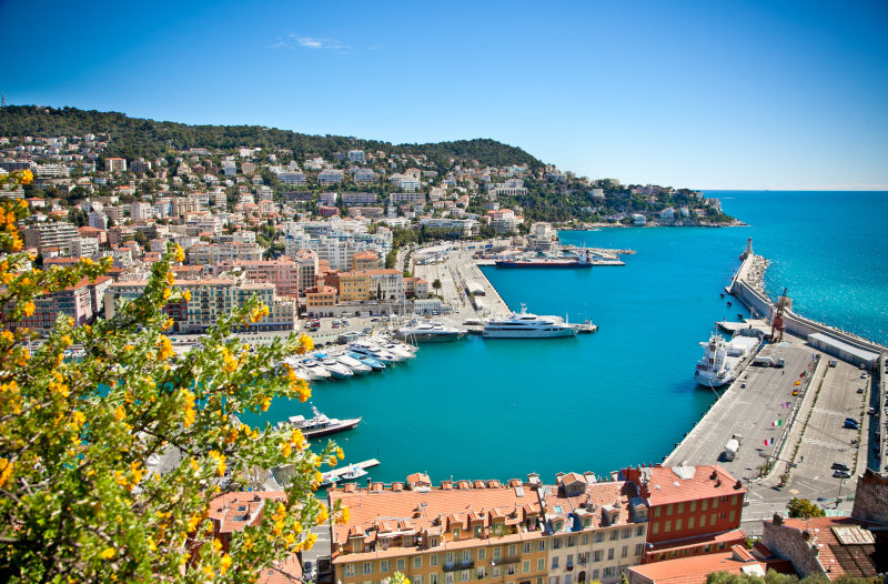 Enchanting Travels France Tours Panoramic view of Nice harbour with blue sky, France
