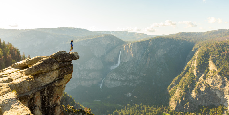 Hiker at the Glacier Point with View to Yosemite Falls and Valley