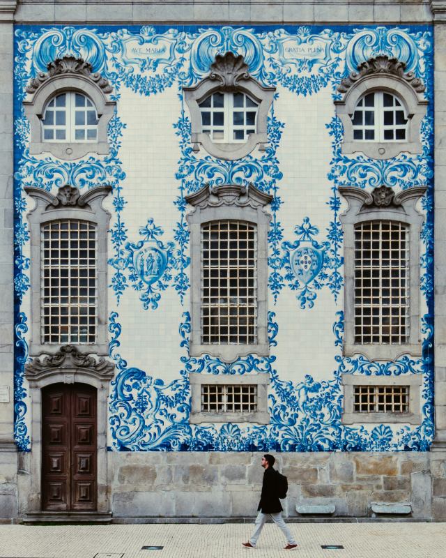 man-walking-on-roadside-near-building-portugal